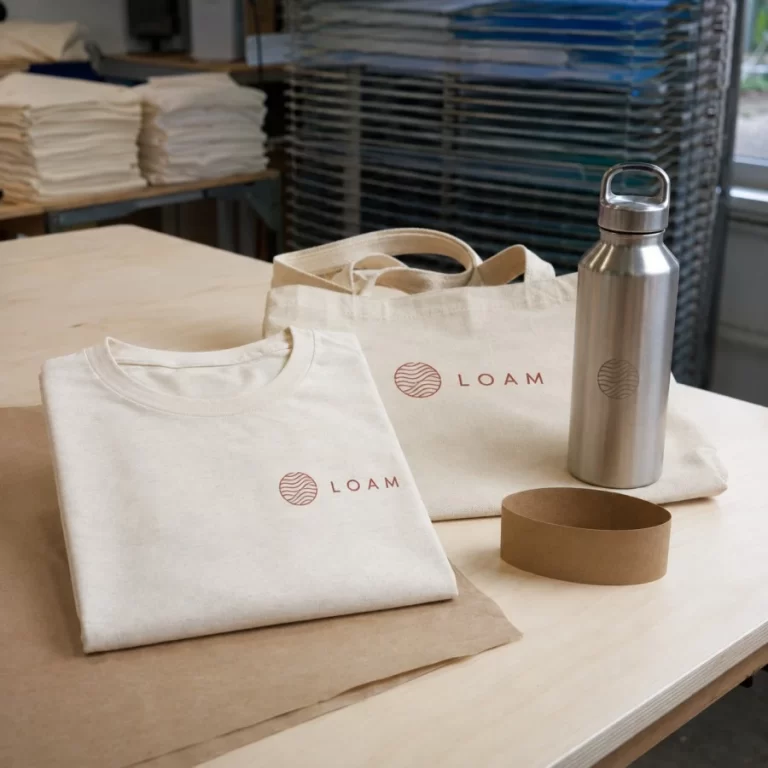 Reusable bottles and organic cotton apparel for a corporate merch order